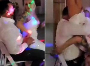 MLADA JE SELA MLADOŽENJI U KRILO NASRED PODIJUMA i zatresla pozadinom! A onda je usledio haos: Podigla je noge, obgrlila muževljevu facu i zavrtela! (VIDEO)